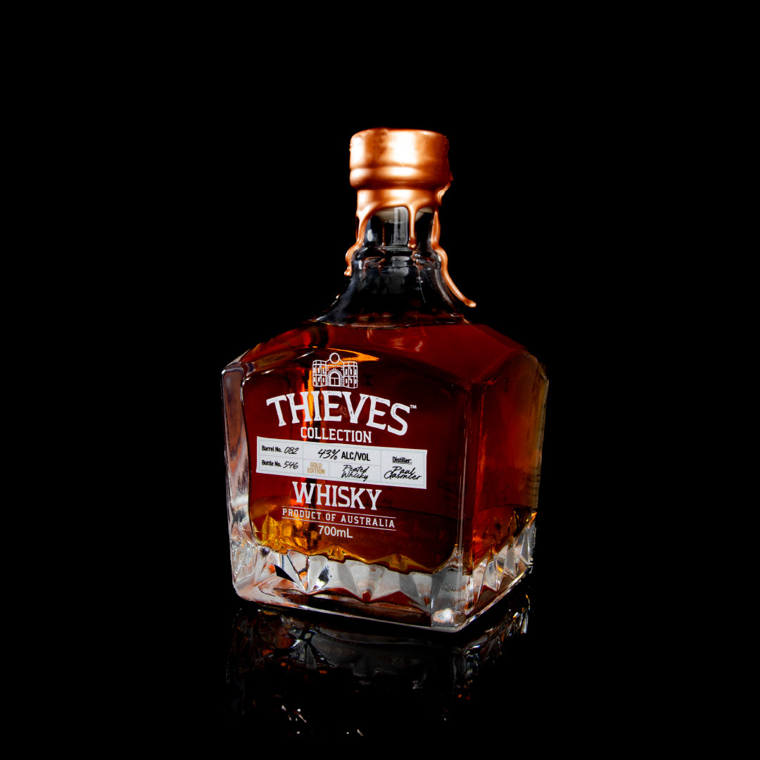 Side view of Whisky Gold bottle from Thieves Collection with detailed labeling